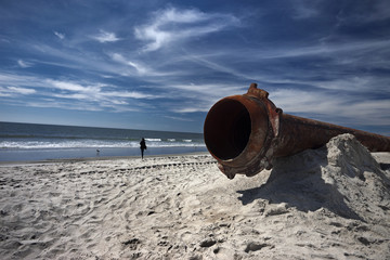 rusty pipes along the sea beach