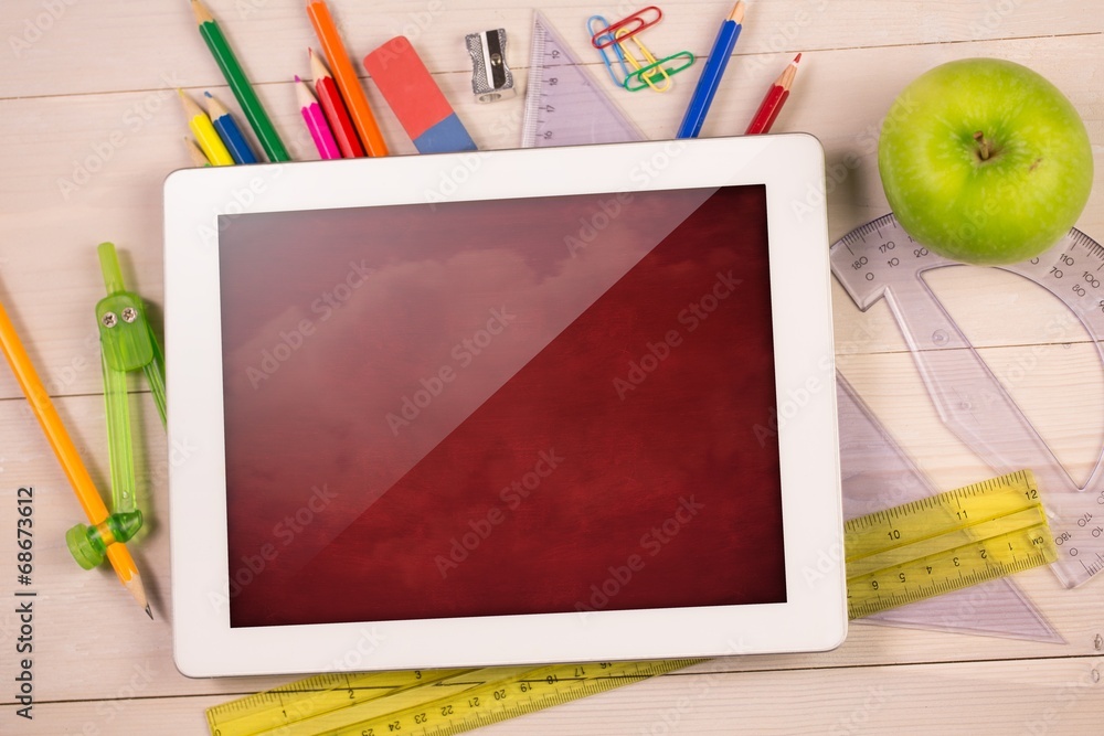 Poster composite image of digital tablet on students desk