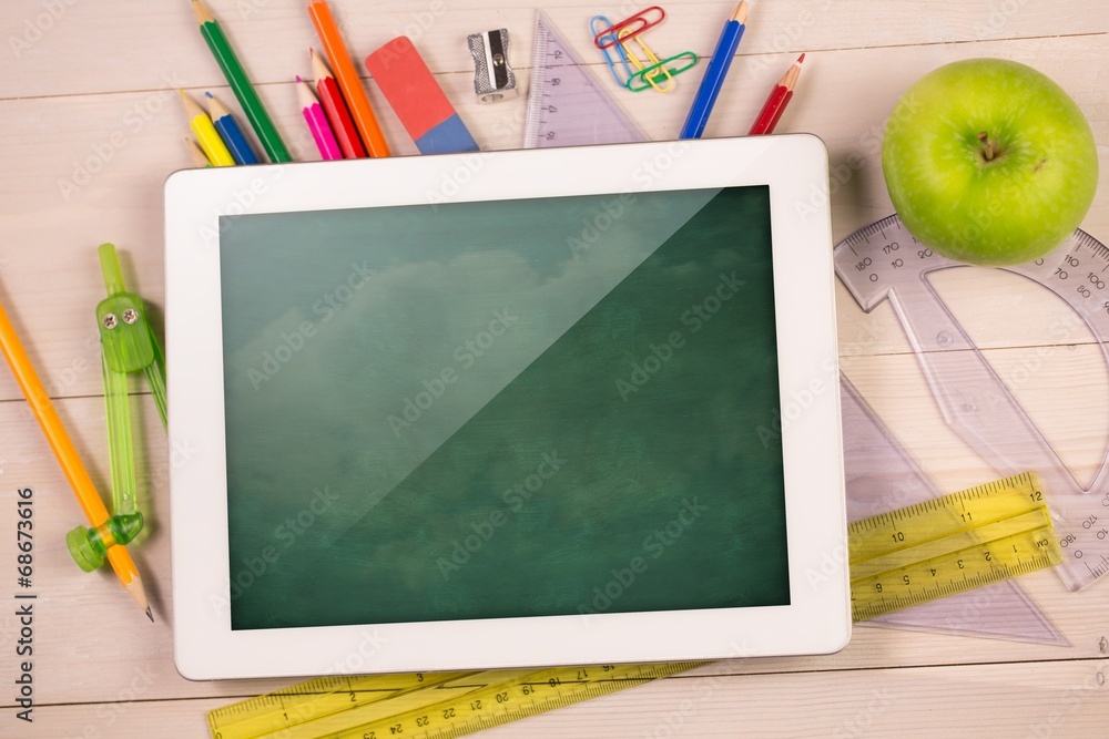 Poster composite image of digital tablet on students desk