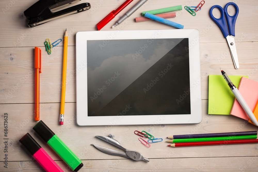 Poster composite image of digital tablet on students desk