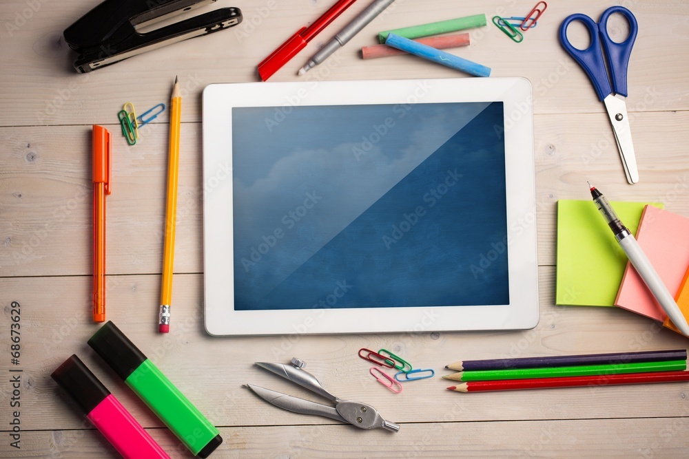 Poster composite image of digital tablet on students desk