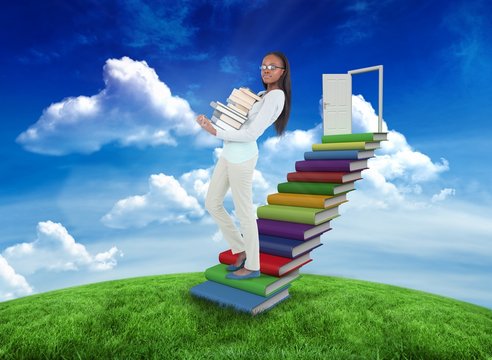 Composite image of student holding books