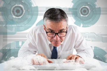 Composite image of mature businessman typing on keyboard - Powered by Adobe