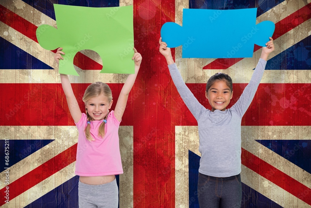 Poster composite image of elementary pupils holding jigsaw pieces
