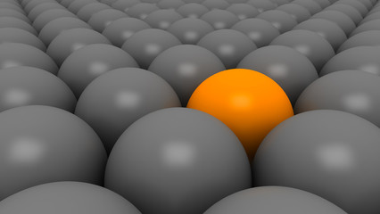 orange ball between gray balls