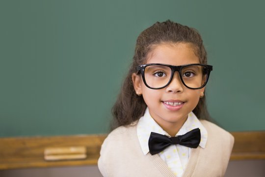 Cute Pupil Dressed Up As Teacher In Classroom