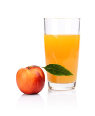 Close-up shot sliced orange nectarine with juice and leaf