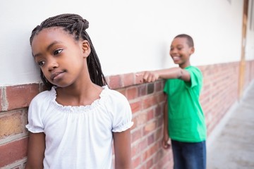 Pupil bullying another in the hall