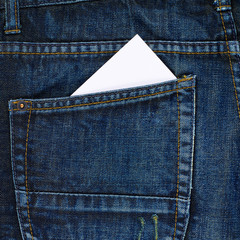 White card in a back pocket of a jeans