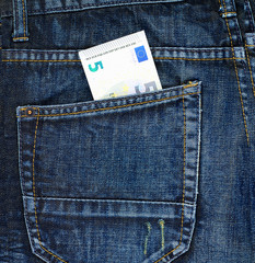 Five euro in a back pocket of a jeans