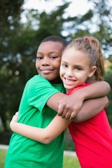 Cute children smiling at camera outside