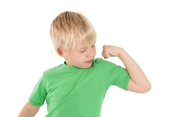 Cute little boy flexing his arm