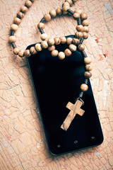 rosary and smartphone