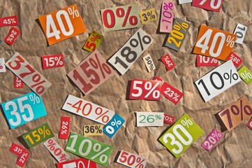 DISCOUNTS background is made up of multi-colored cut out figures