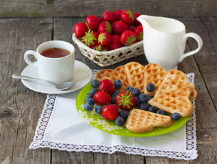 morning tea with waffles, milk and fresh berries