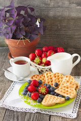 morning tea with waffles, milk and fresh berries