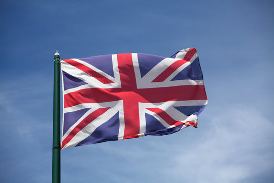 The flag of United Kingdom  waving on wind