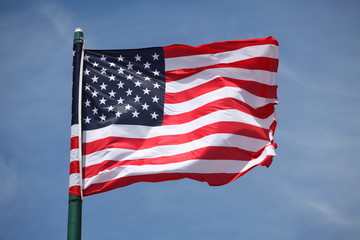 Fototapeta premium American flag on the blue sky