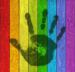 Handabdruck auf Farbiger Holzwand