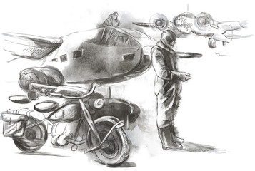 At the airport - a soldier on a motorcycle between aircraft