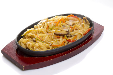 Udon noodles. Asian food. Vegetables. Mushrooms. Isolated.