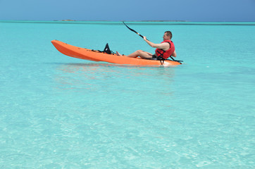 A man with kayak. Exuma, Bahamas