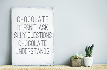 old  rustic poster with quote about chocolate and succulents