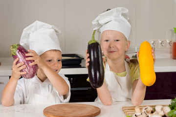 Cute Little Chefs Holding Huge Vegetables