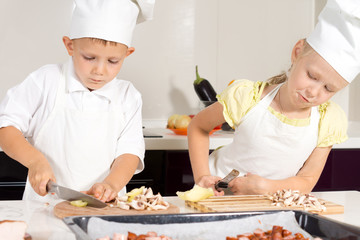 Kid Chefs Slicing Ingredients on Chopping Board