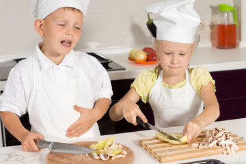 Cute Little Chefs Slicing Pizza Ingredients