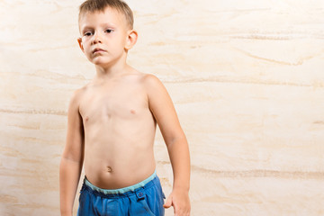 Topless Little Serious Kid on Blue Short Pants
