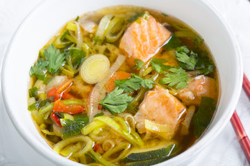 Miso soup with salmon close-up.