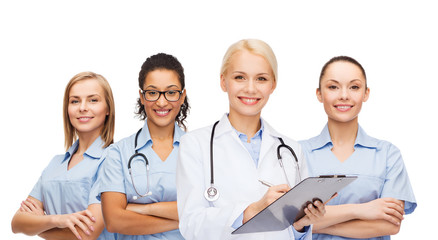smiling female doctor and nurses with stethoscope