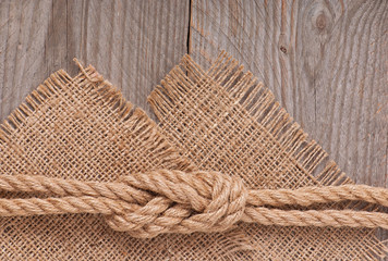 Fototapeta na wymiar ship rope on wooden texture background