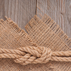 Fototapeta na wymiar ship rope on wooden texture background