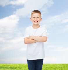 Fototapeta na wymiar smiling little boy in white blank t-shirt