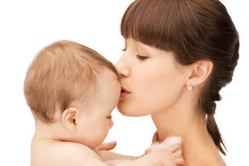 happy mother kissing baby