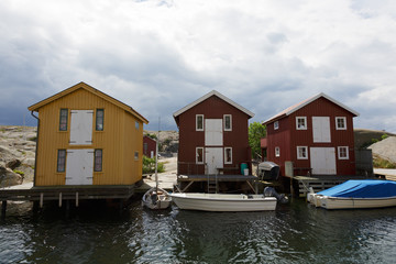 Boathouses at famous Smögen bridge in Bohuslän, Sweden.
