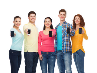 group of smiling teenagers with smartphones