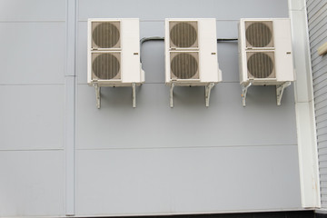 Three split-system on gray wall