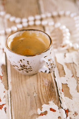 Obraz na płótnie Canvas Coffee cup on old wooden table
