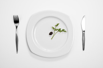 Single black olive and parsley