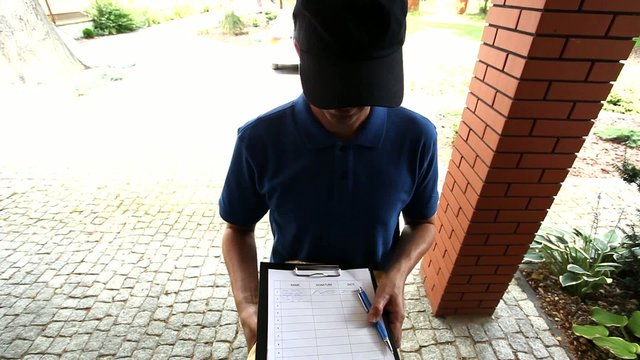 Man delivering a package and asking for a signature  film