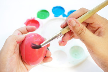 Children's hand painting Easter eggs