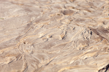 Sand surface with the relief formed by water currents