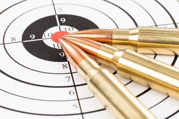 Rifle bullet over target background