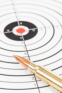 Rifle bullet over target background