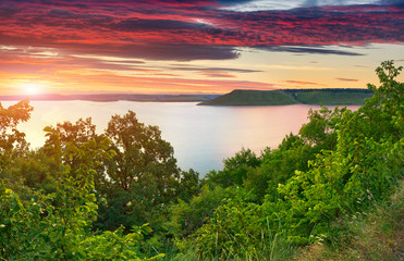Majestic summer sunset in the river. HDR image