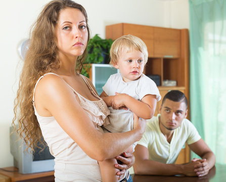  family of three with baby having quarrel