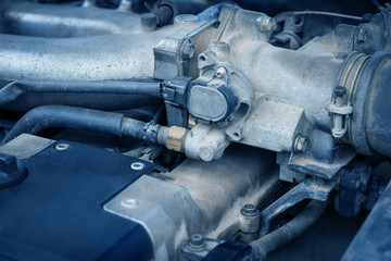 Old and dirty car engine, detail view. Color toned image.